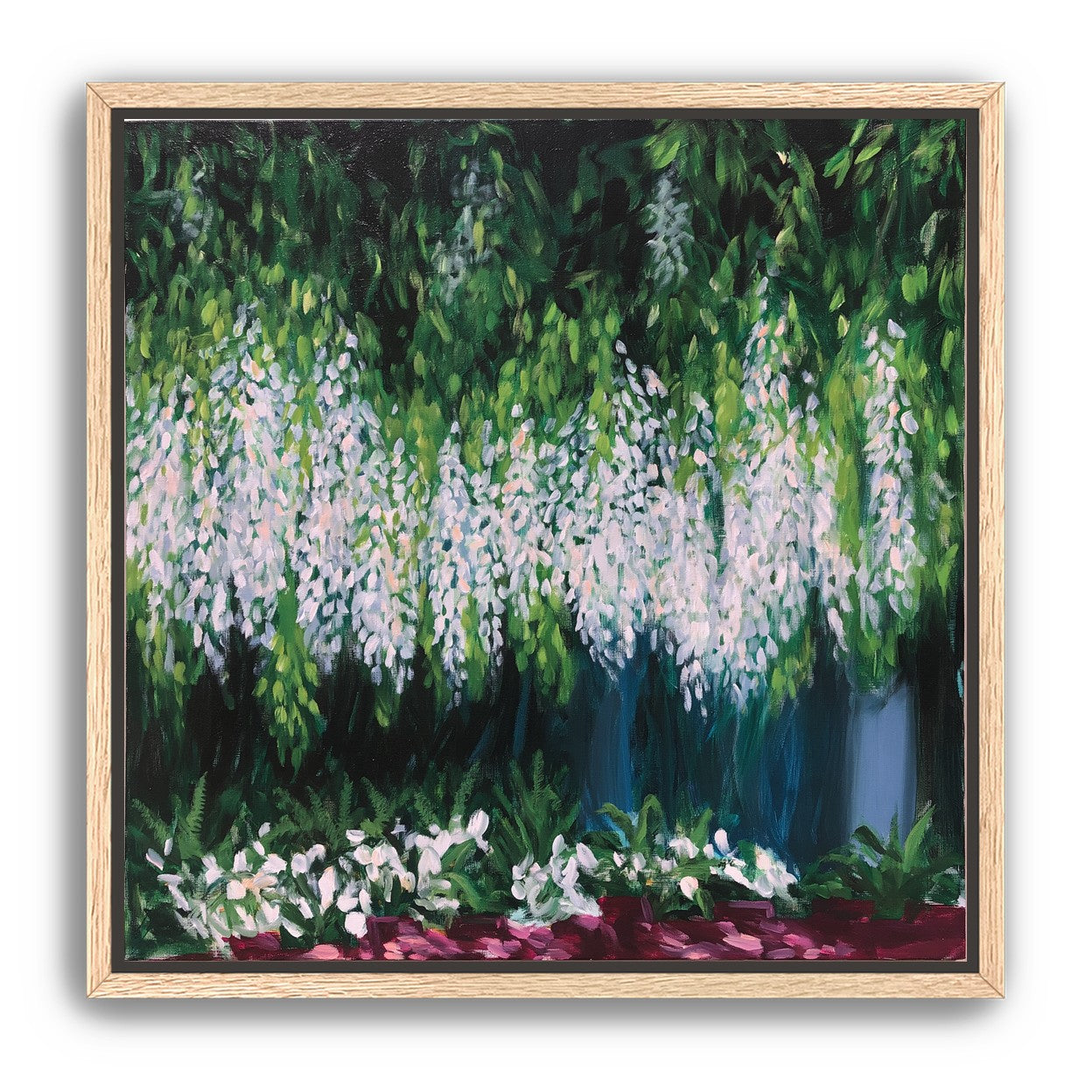 Pale blossoms in green shade