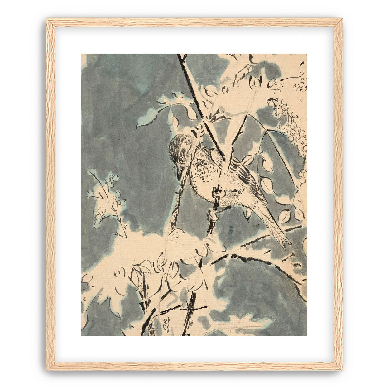 Quiet bird in berry branches