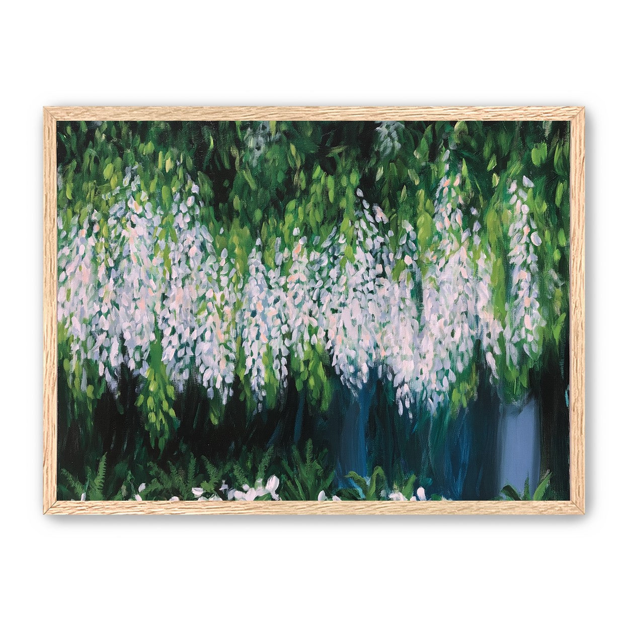 Pale blossoms in green shade