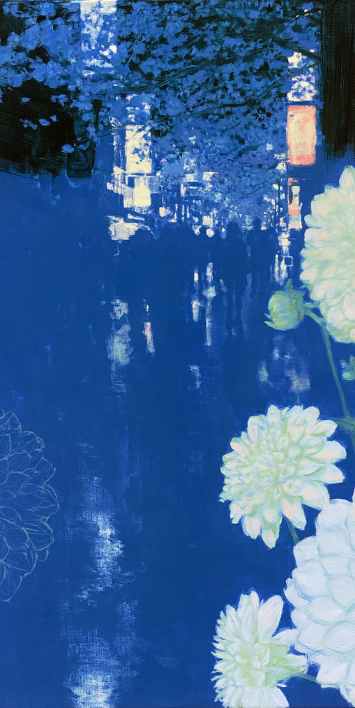 White blooms on blue canal