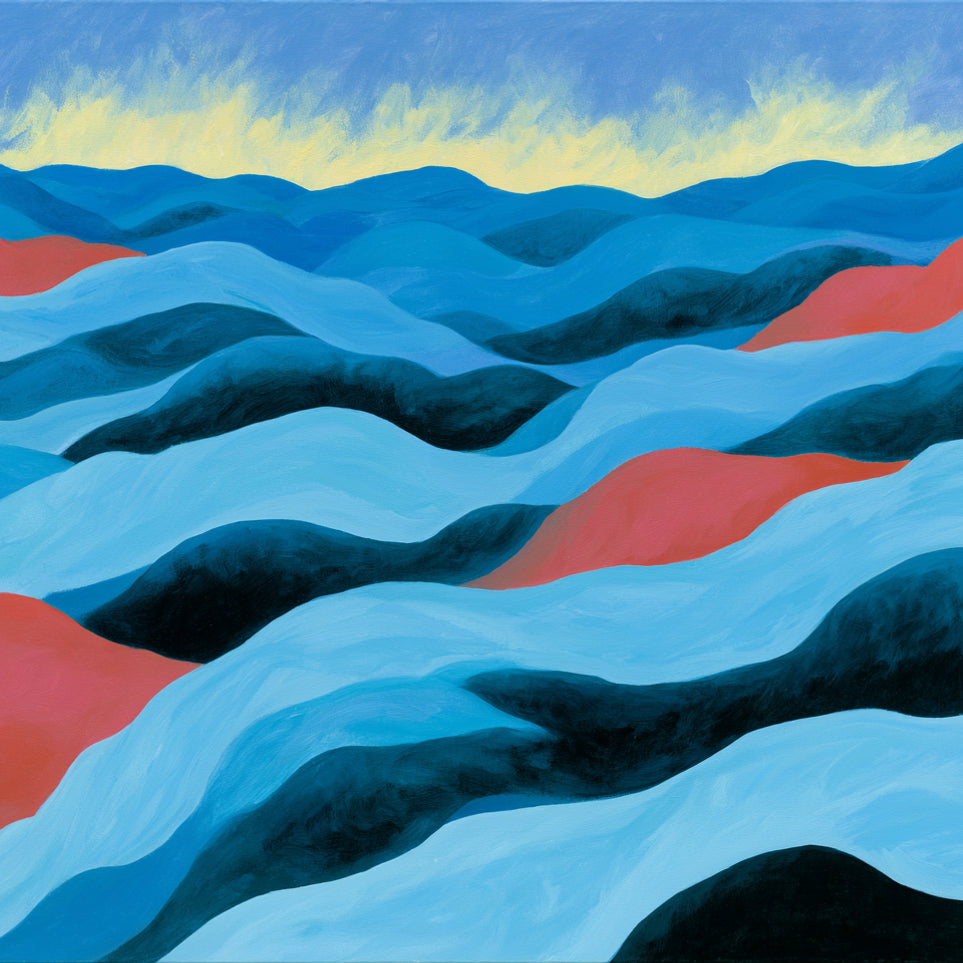 Blue hills under pale sky