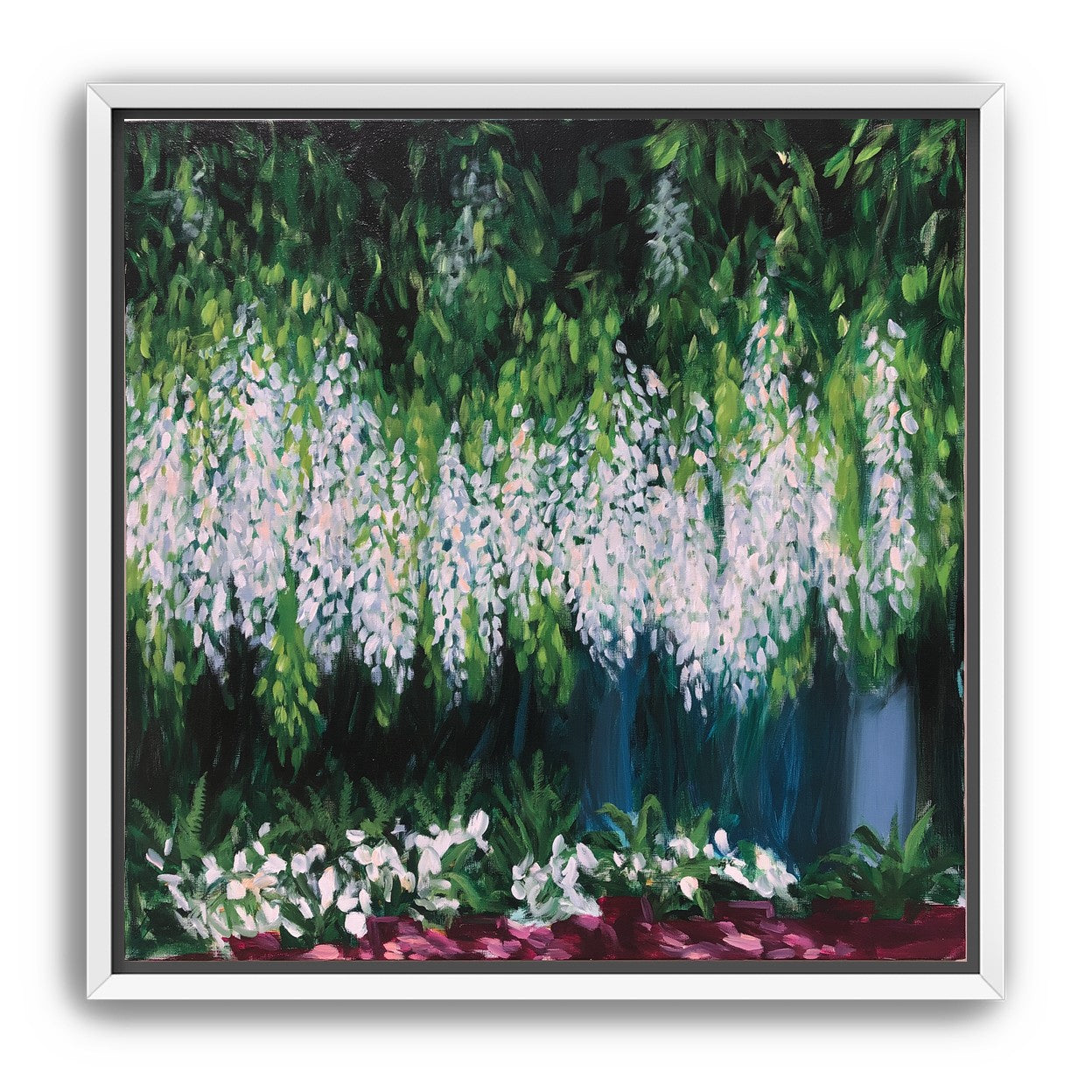 Pale blossoms in green shade