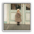 A child beneath pale doors