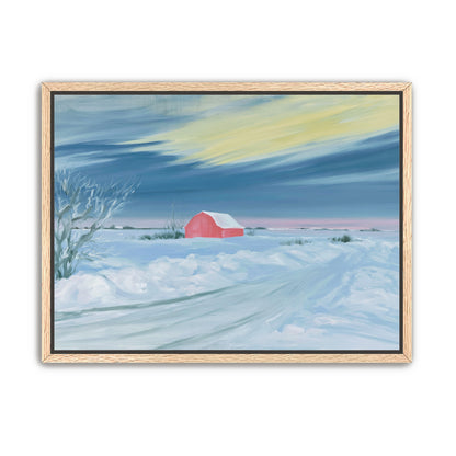 Red barn beneath winter sky