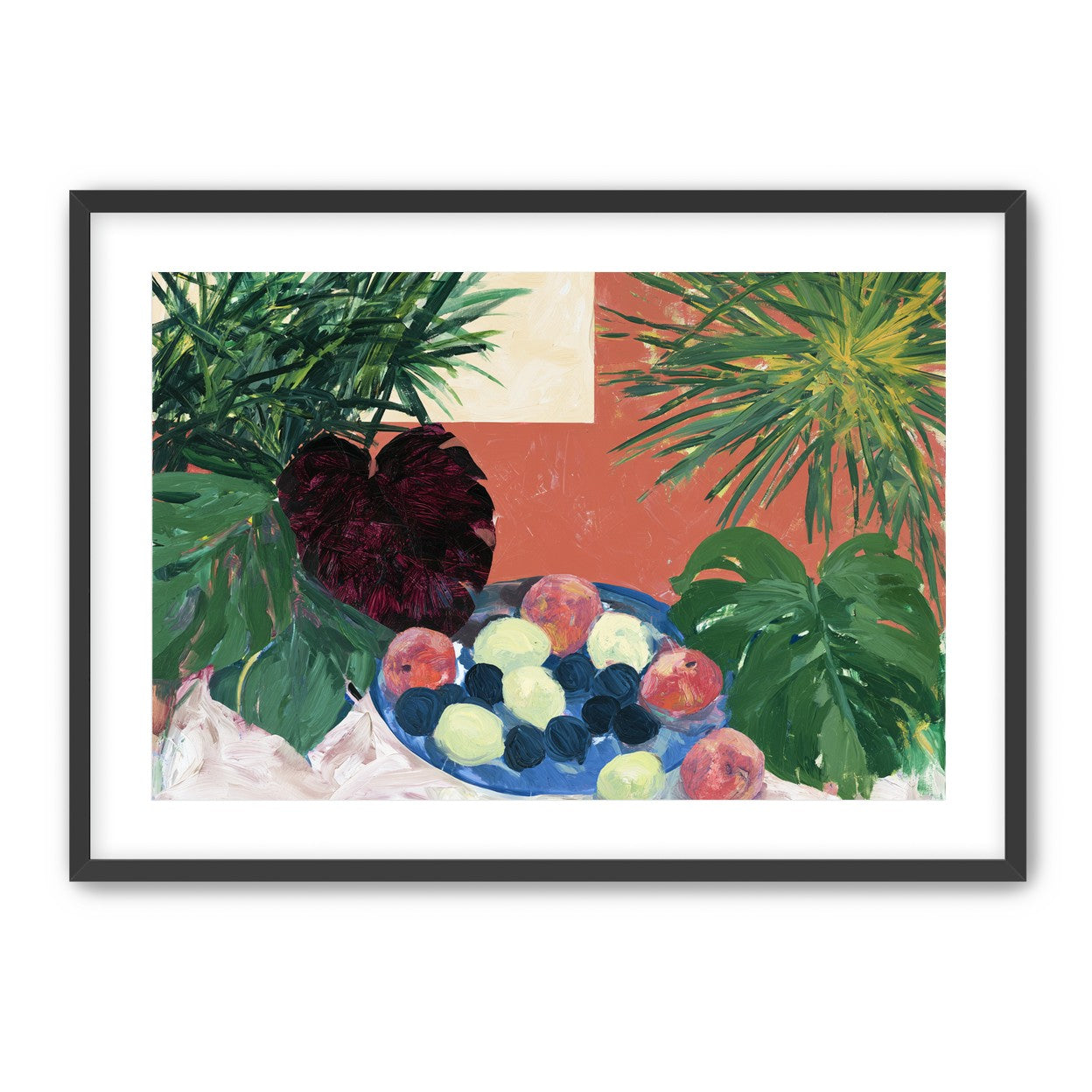 Coral wall behind green leaves