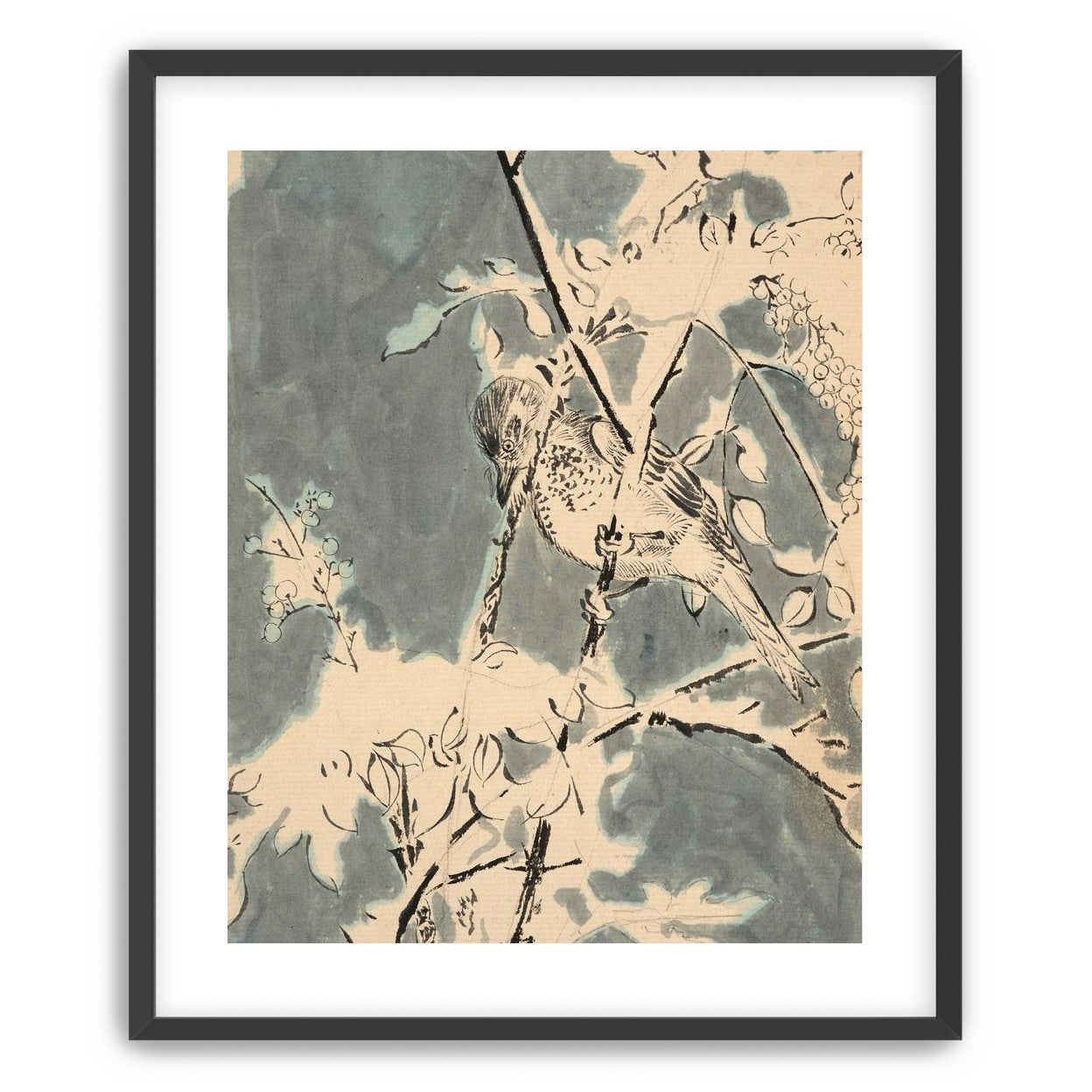 Quiet bird in berry branches