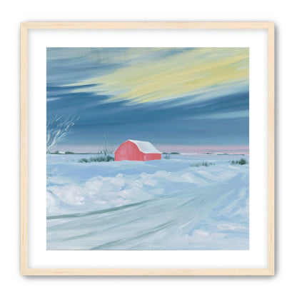 Red barn beneath winter sky