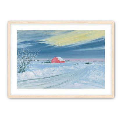 Red barn beneath winter sky