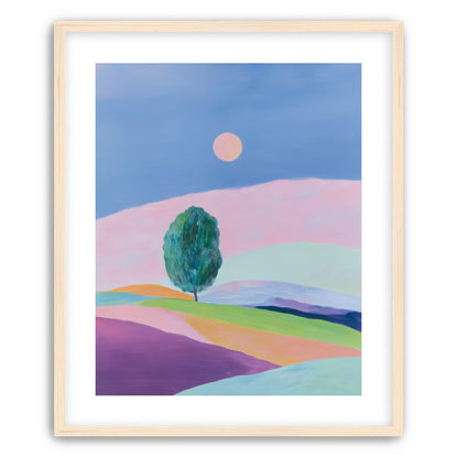 A pale sun above hills