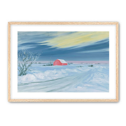 Red barn beneath winter sky