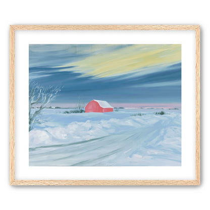 Red barn beneath winter sky