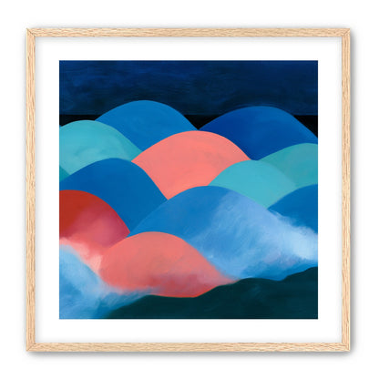 Pink moon among blue hills