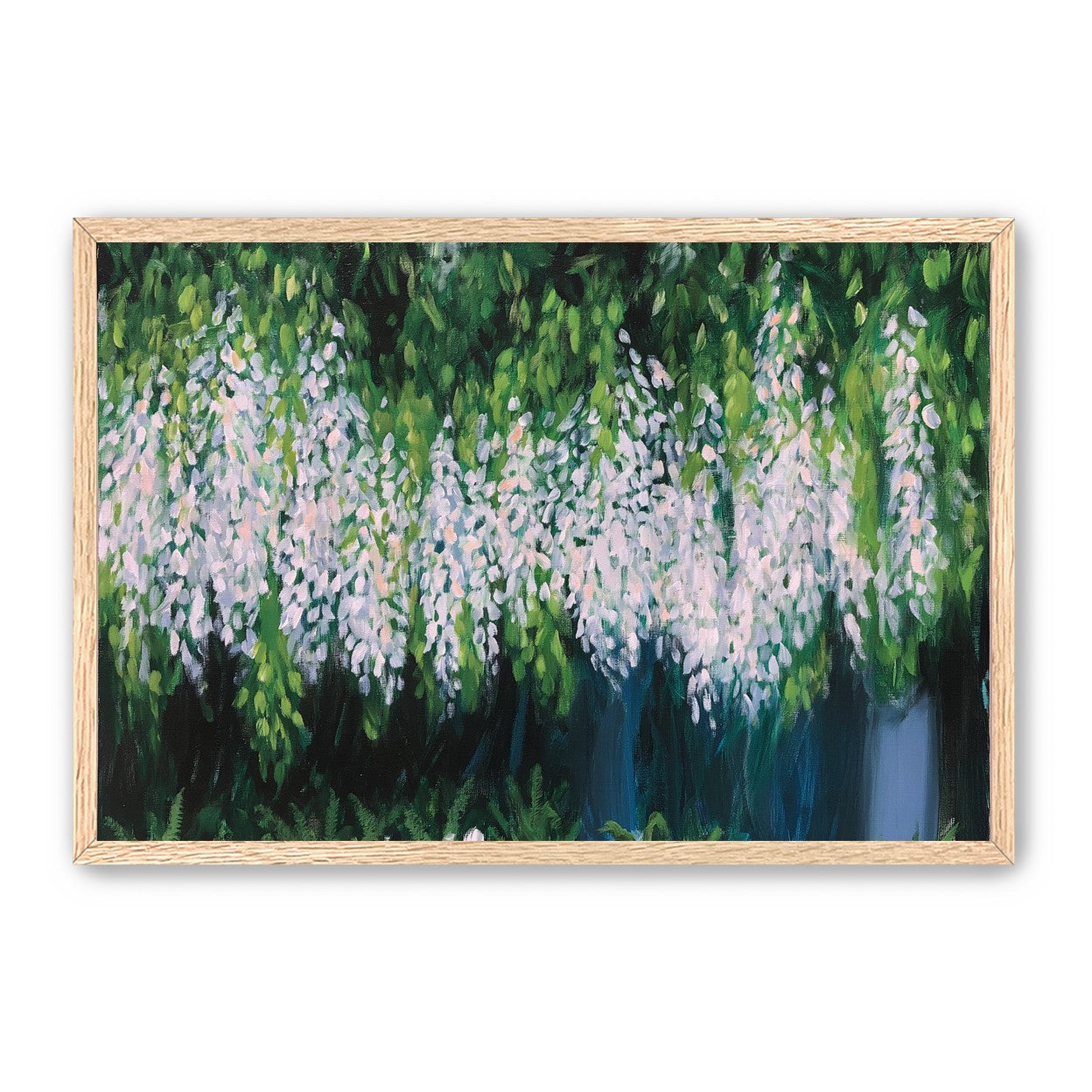 Pale blossoms in green shade
