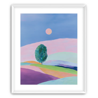 A pale sun above hills