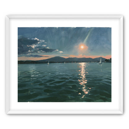 Peach sun on blue water