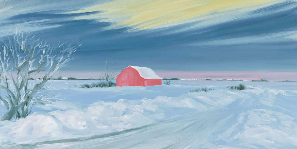 Red barn beneath winter sky