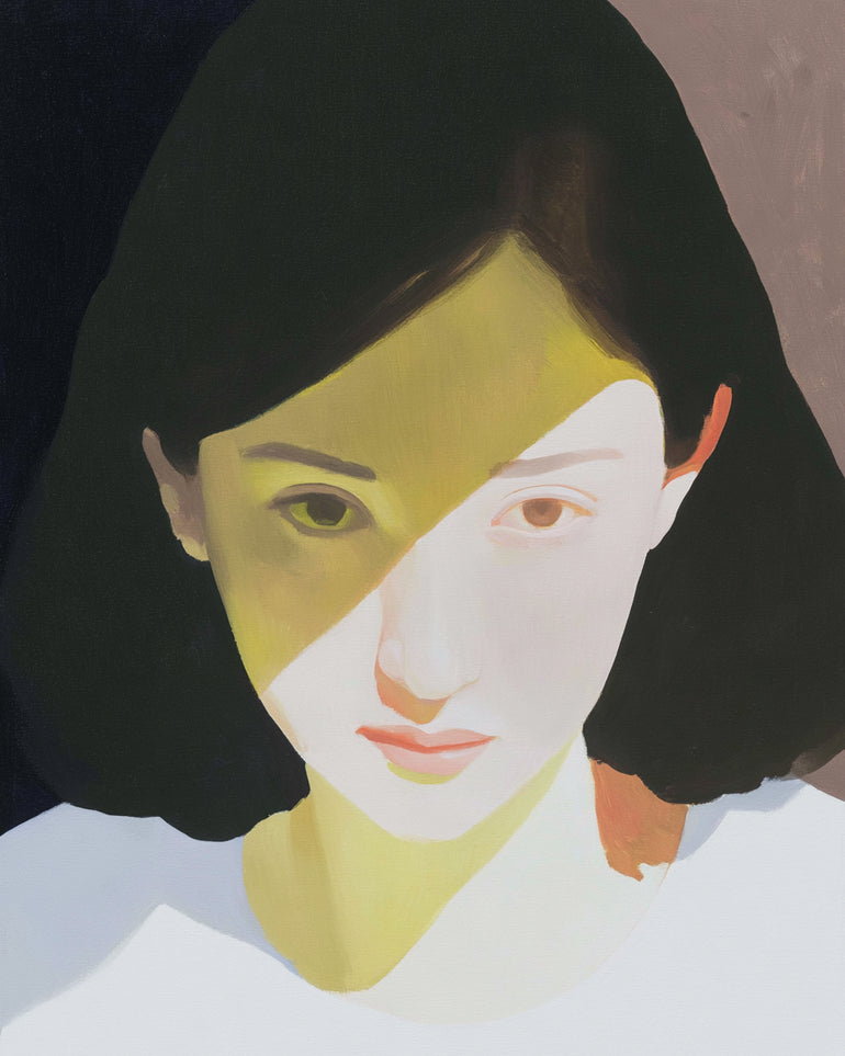 Yellow light across her face