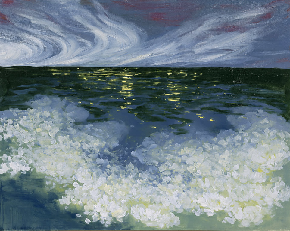 Foam and starlight at sea