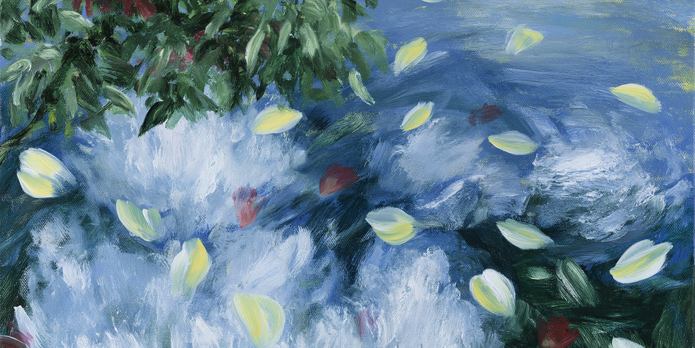 Petals across the blue water