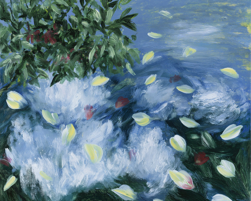 Petals across the blue water