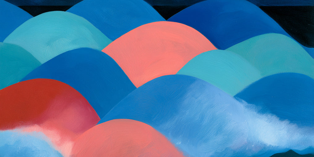 Pink moon among blue hills