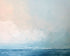 Quiet sea under pale sky