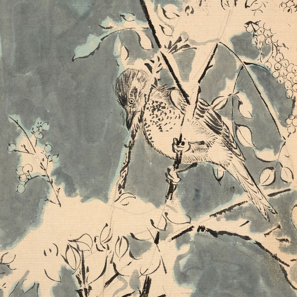 Quiet bird in berry branches