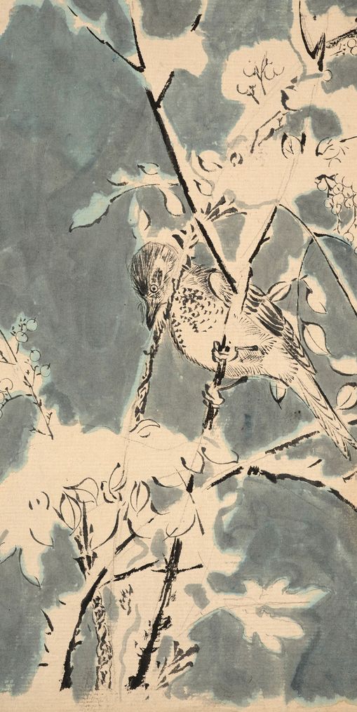 Quiet bird in berry branches