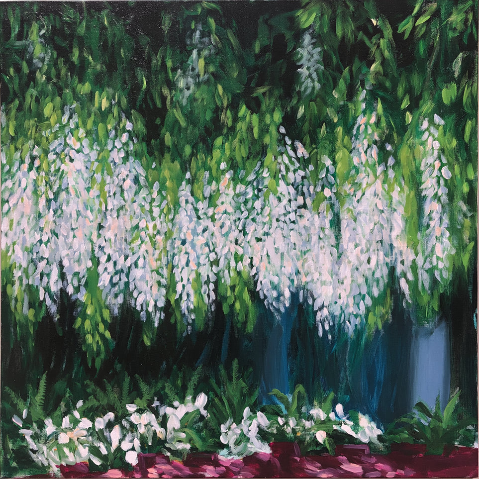 Pale blossoms in green shade
