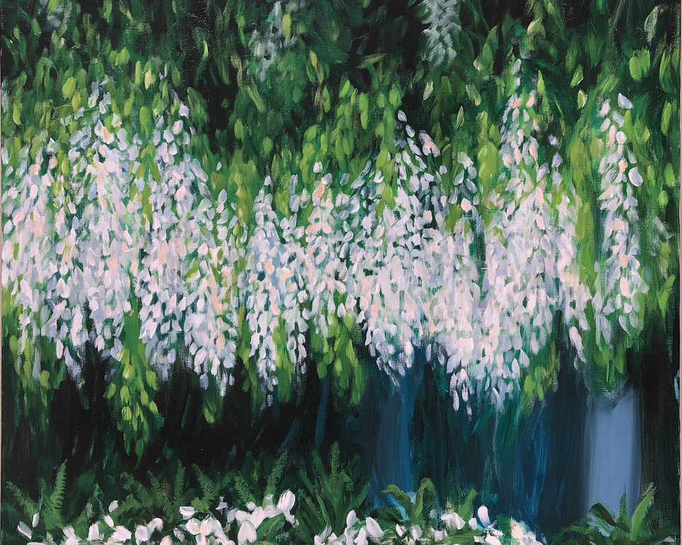Pale blossoms in green shade