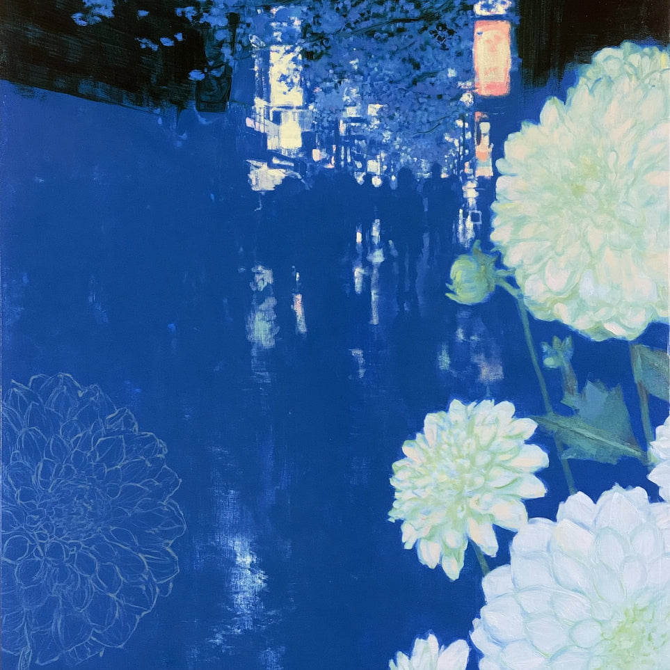 White blooms on blue canal