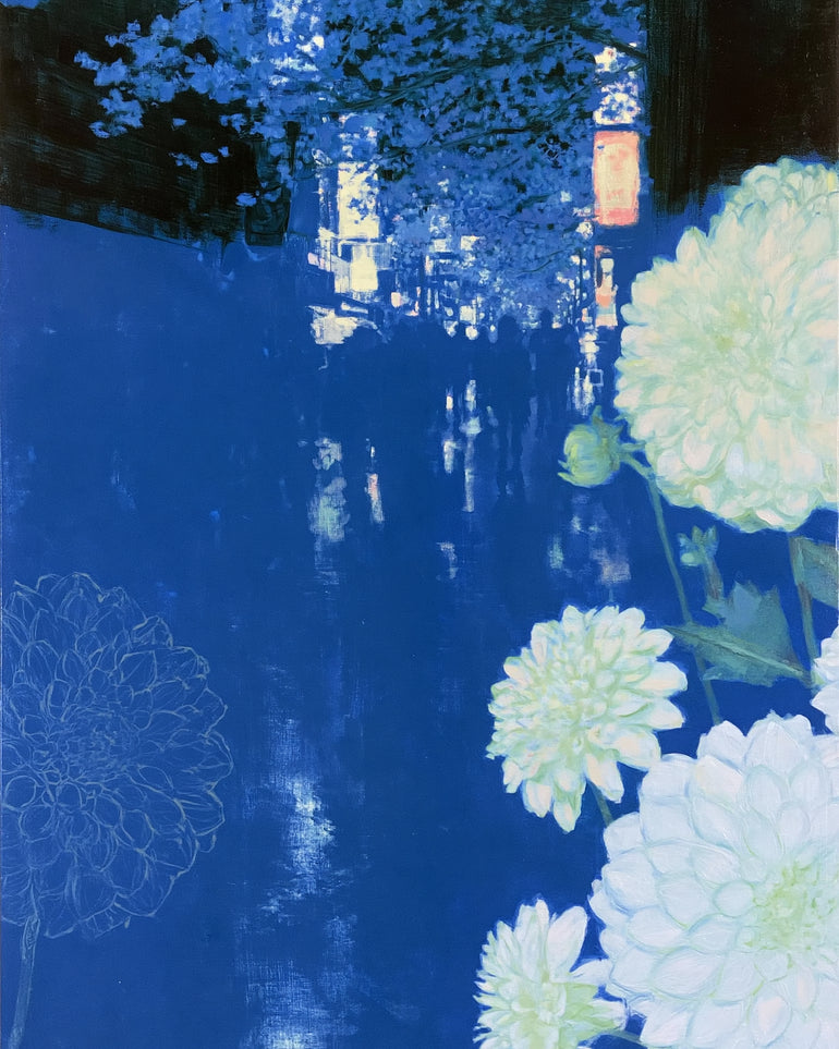White blooms on blue canal