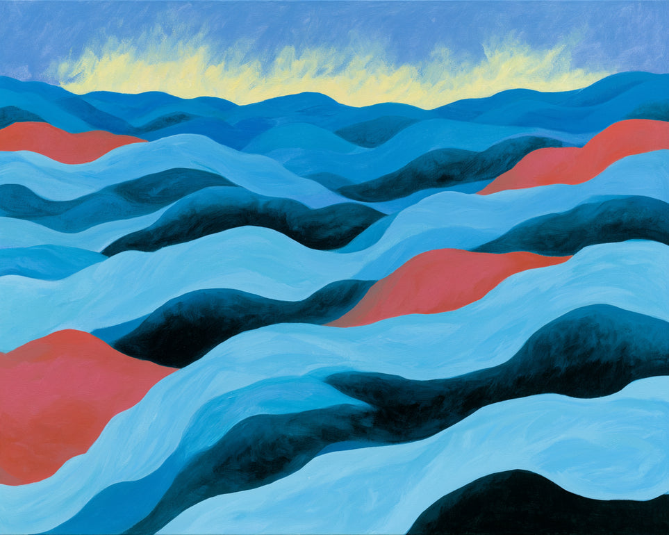 Blue hills under pale sky