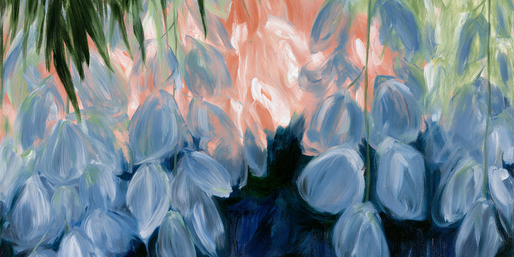 Blue flowers under green leaves