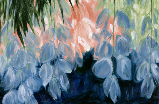 Blue flowers under green leaves