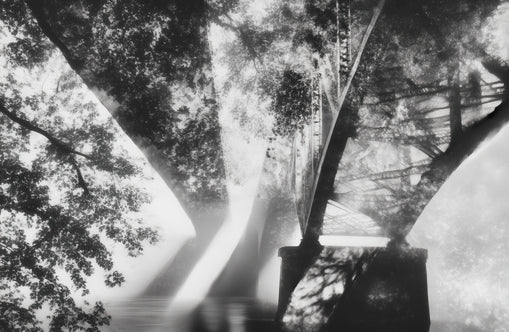 Steel Bridge Over a Slow River in Sunlight