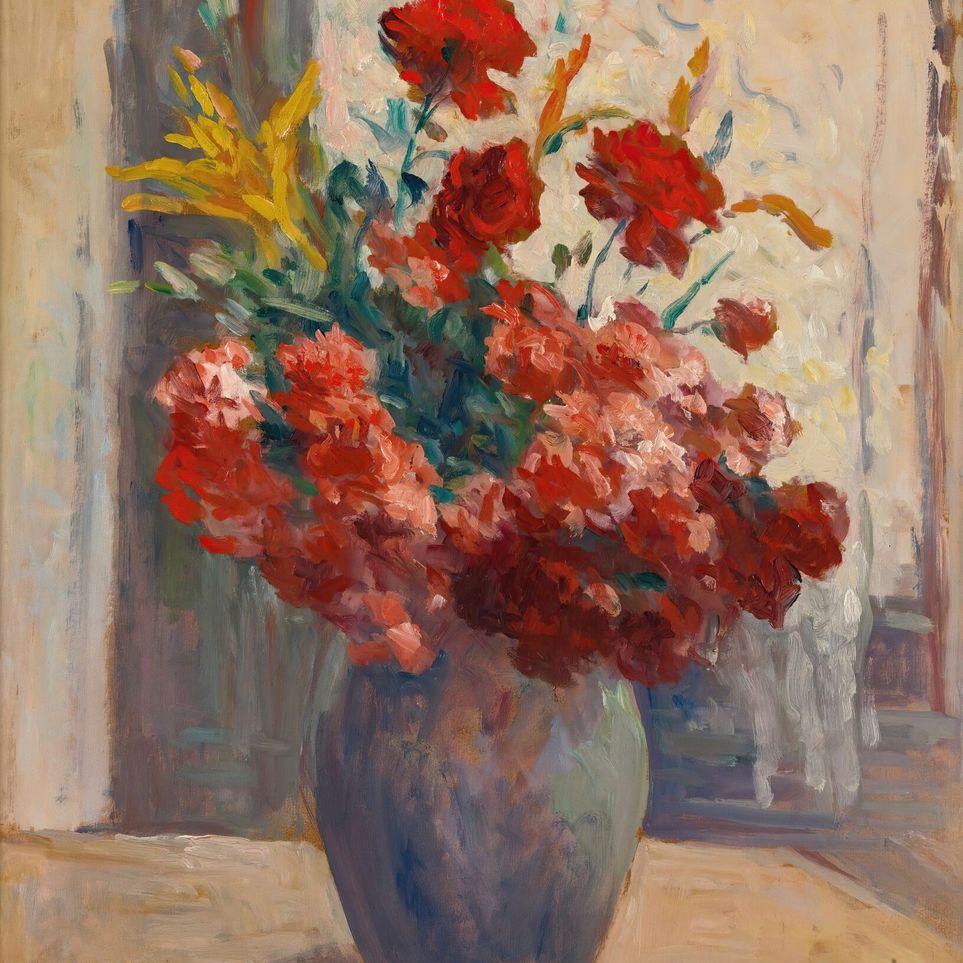 Flowers within a tall vase